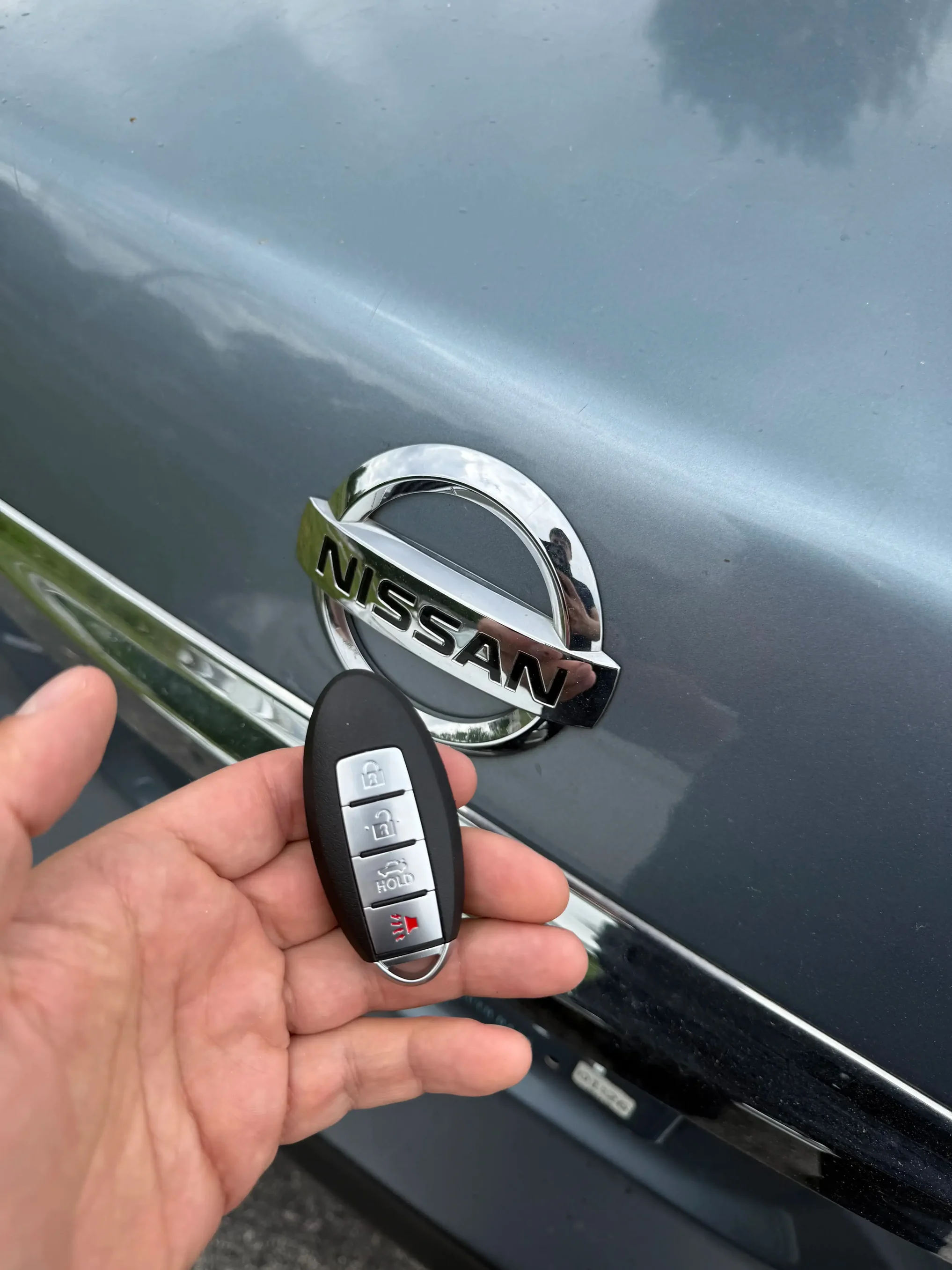 Locksmith programming a Nissan Altima key fob using professional diagnostic tool in Bowling Green Kentucky