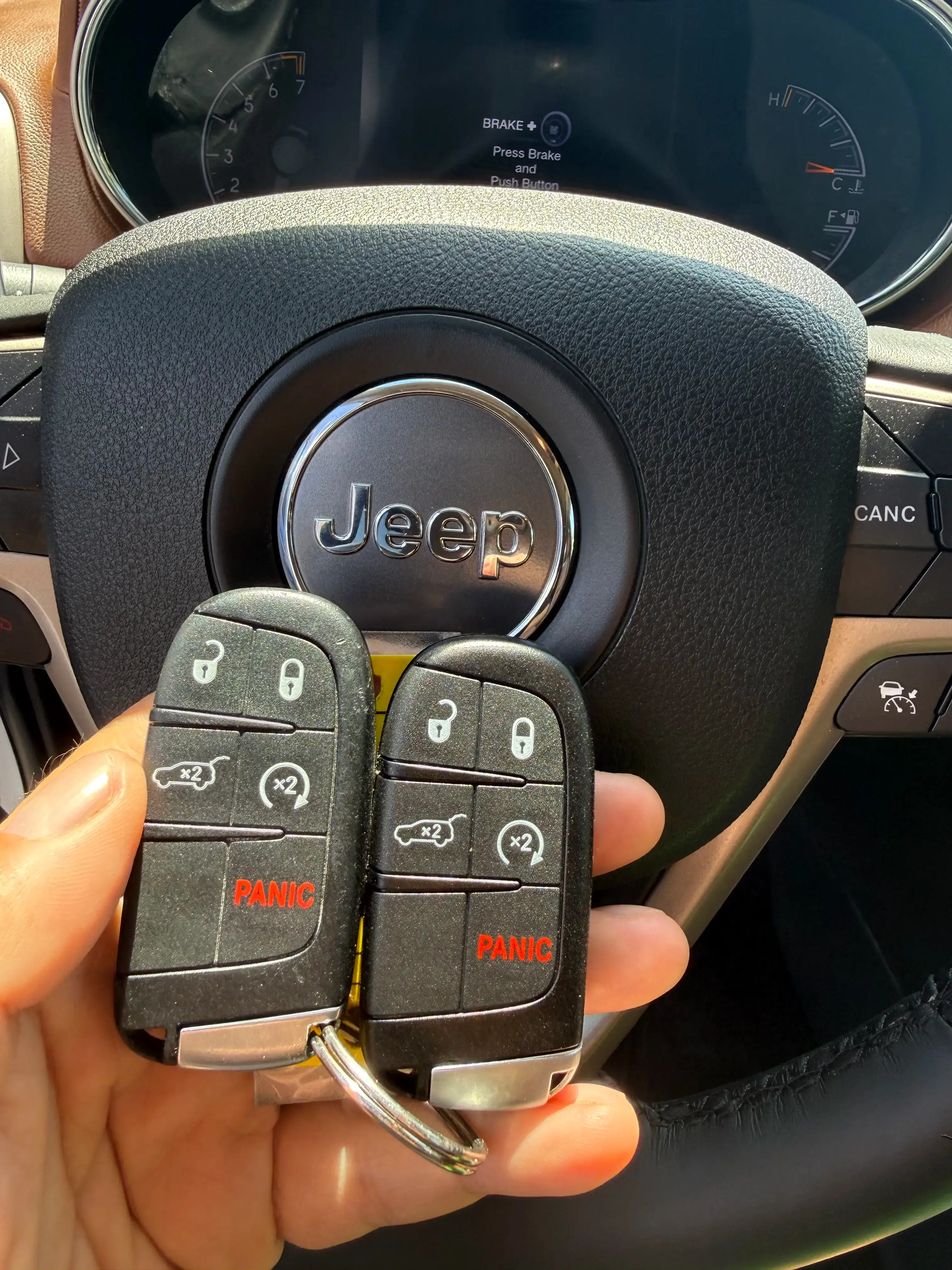 Mobile locksmith cutting and programming a spare proximity key for a 2016 Jeep Grand Cherokee in Bowling Green Kentucky